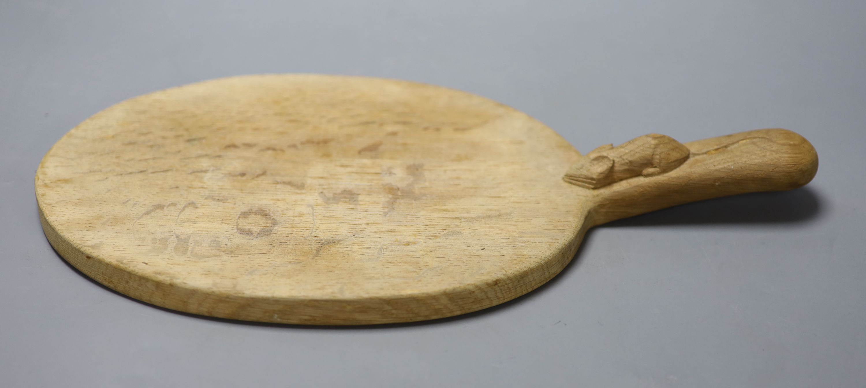 A Robert Thompson, The Mouseman, an oval oak cheese board, length 38cm